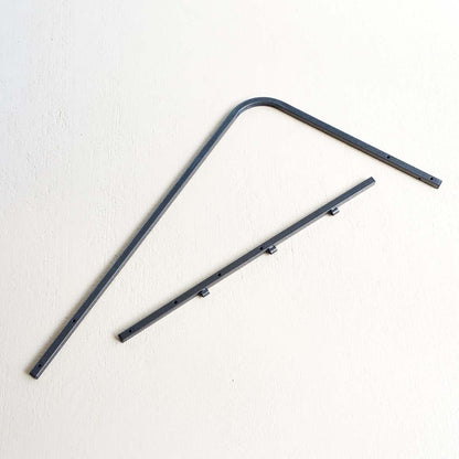 Two metal brackets on a white background