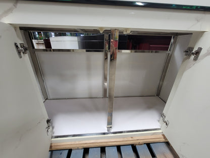 Stainless steel cabinet door with hinges on a white cabinet