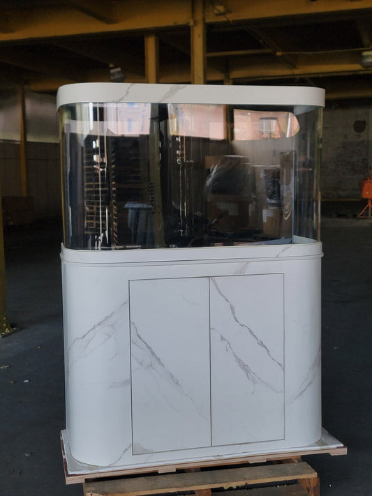 Large fish tank with marble-like design on a pallet in an industrial setting