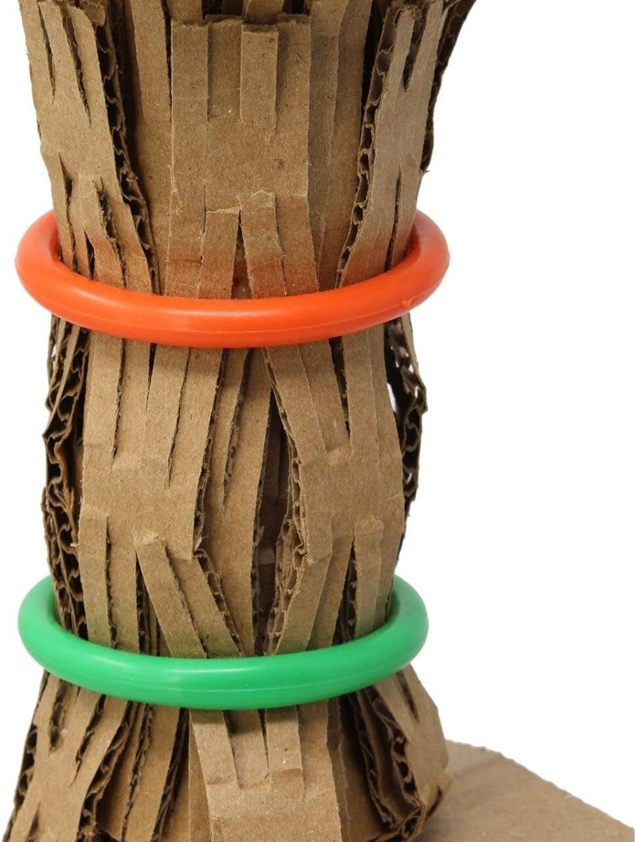 Cardboard tube with orange and green rubber bands on a white background
