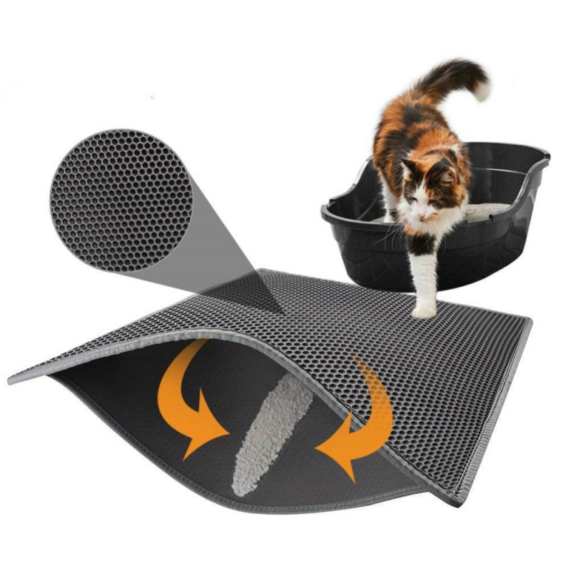 Cat litter mat with textured surface and curved design, featuring a cat climbing into a black litter box.