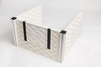 White pet gate with black straps on a light gray background