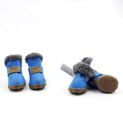 Pair of blue pet boots with gray fur trim on a white background