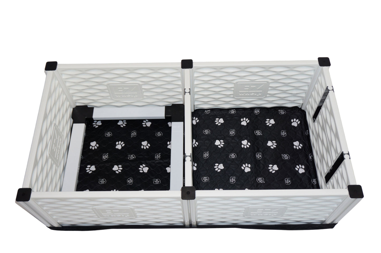 Pet playpen with black paw-patterned mats on a white background