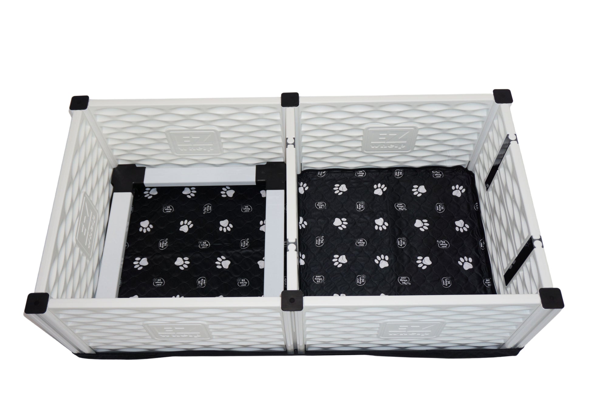 Pet playpen with black paw-patterned mats on a white background