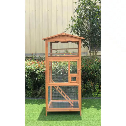 Wooden bird cage with a roof in an outdoor setting