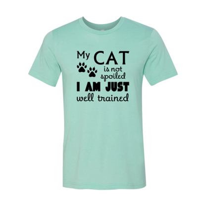 Mint green t-shirt with black text and paw prints on a white background