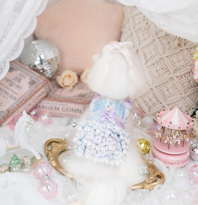 Pastel-colored toy with decorative elements on a soft surface