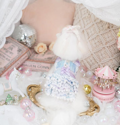 Pastel-colored toy with decorative elements on a soft surface