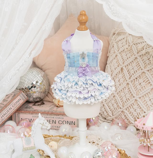 Pastel dress on a mannequin with decorative background