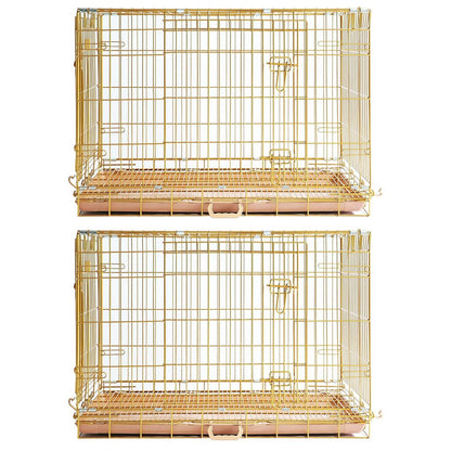 Two gold wire pet cages on a white background