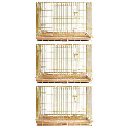 Three gold wire bird cages stacked on a white background