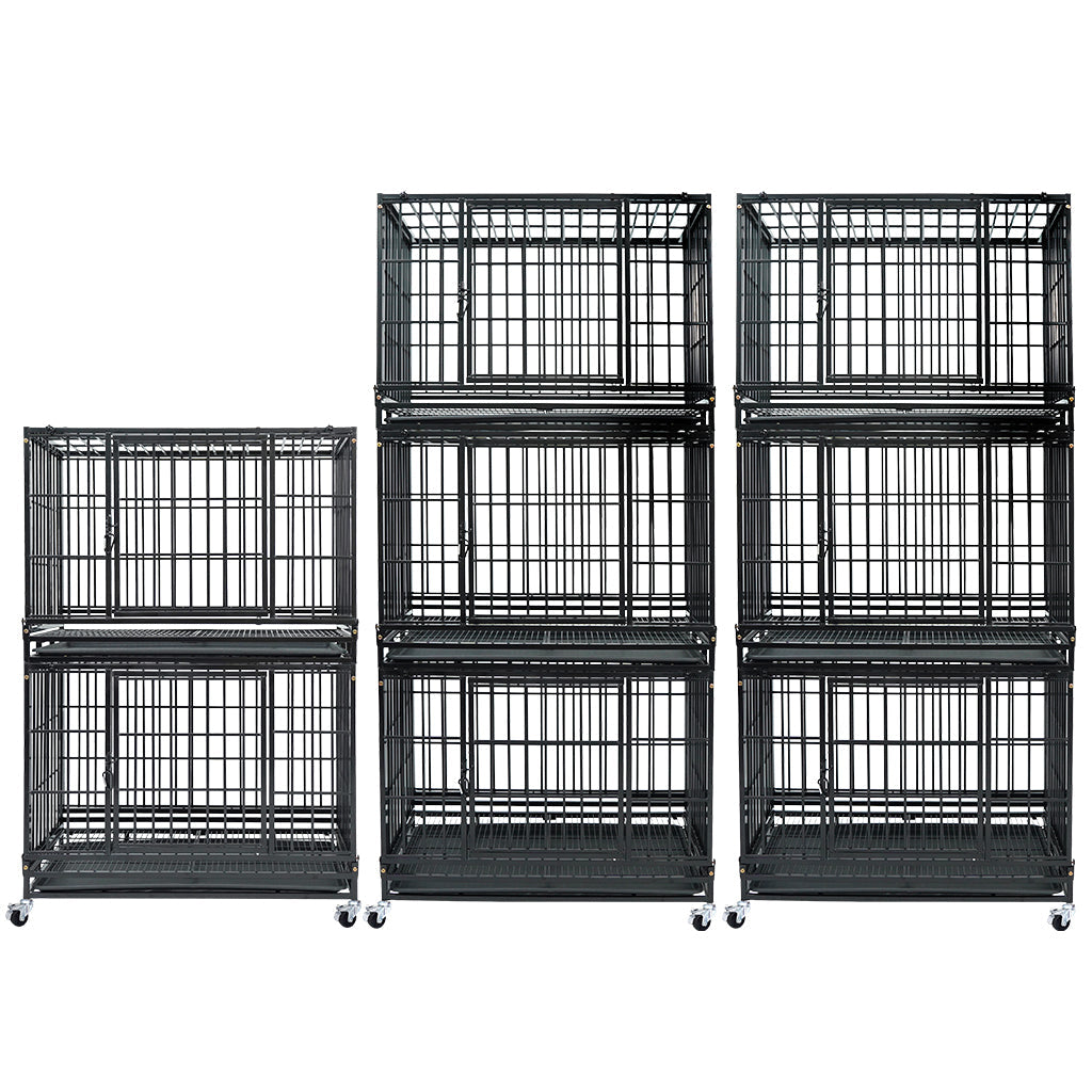 Set of black metal dog crates of different sizes on a white background
