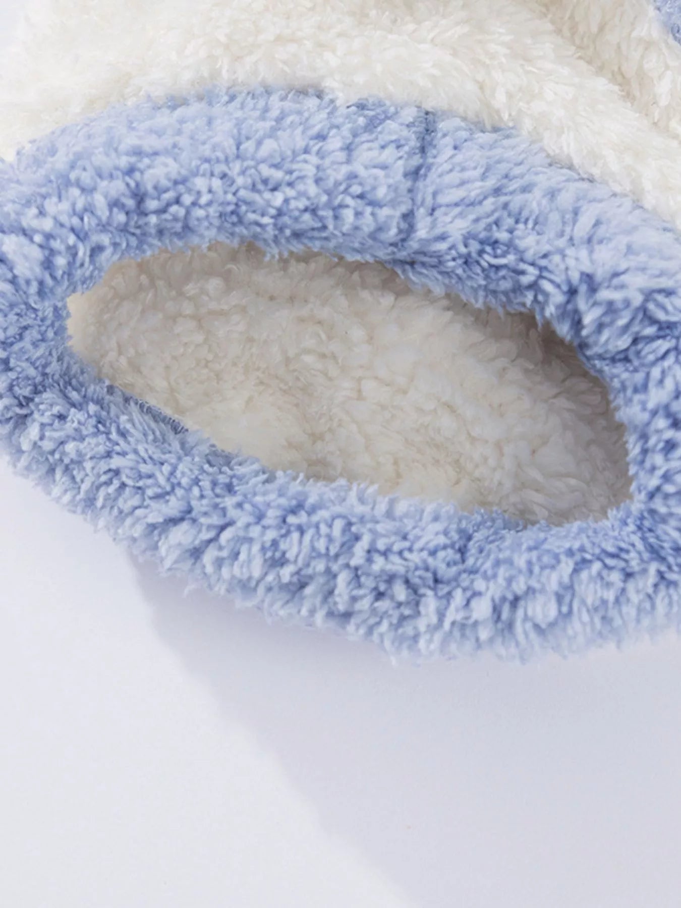 Close-up of a blue and white fluffy fabric product on a white background