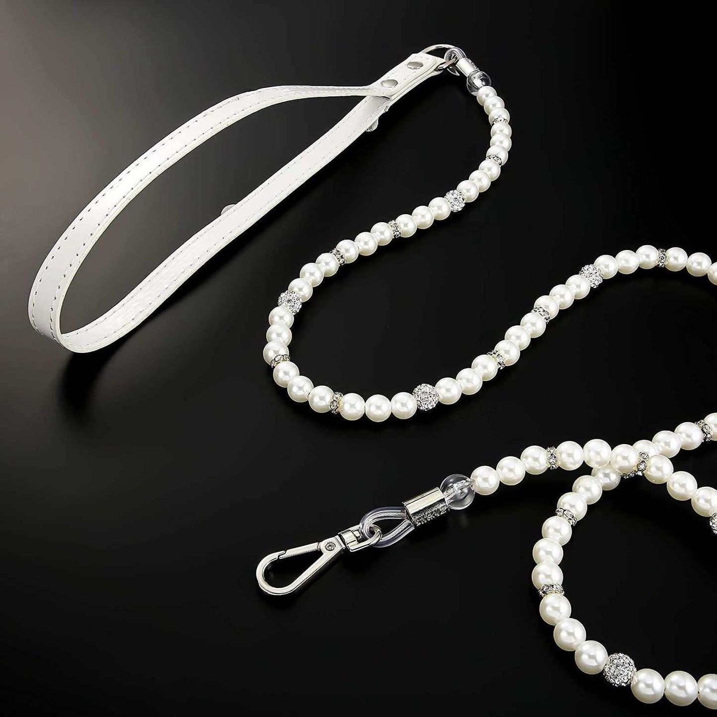 Pearl necklace with silver clasp on a black background