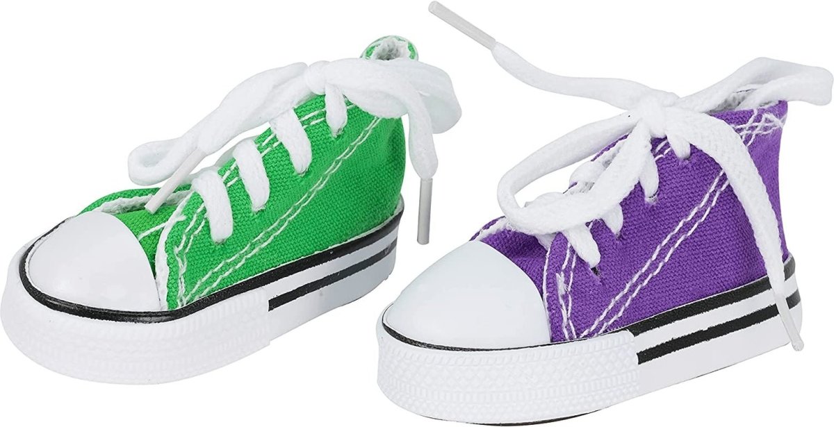 Green and purple sneakers with white laces on a white background
