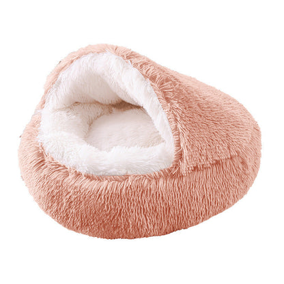 Pink plush pet bed with white interior on a white background