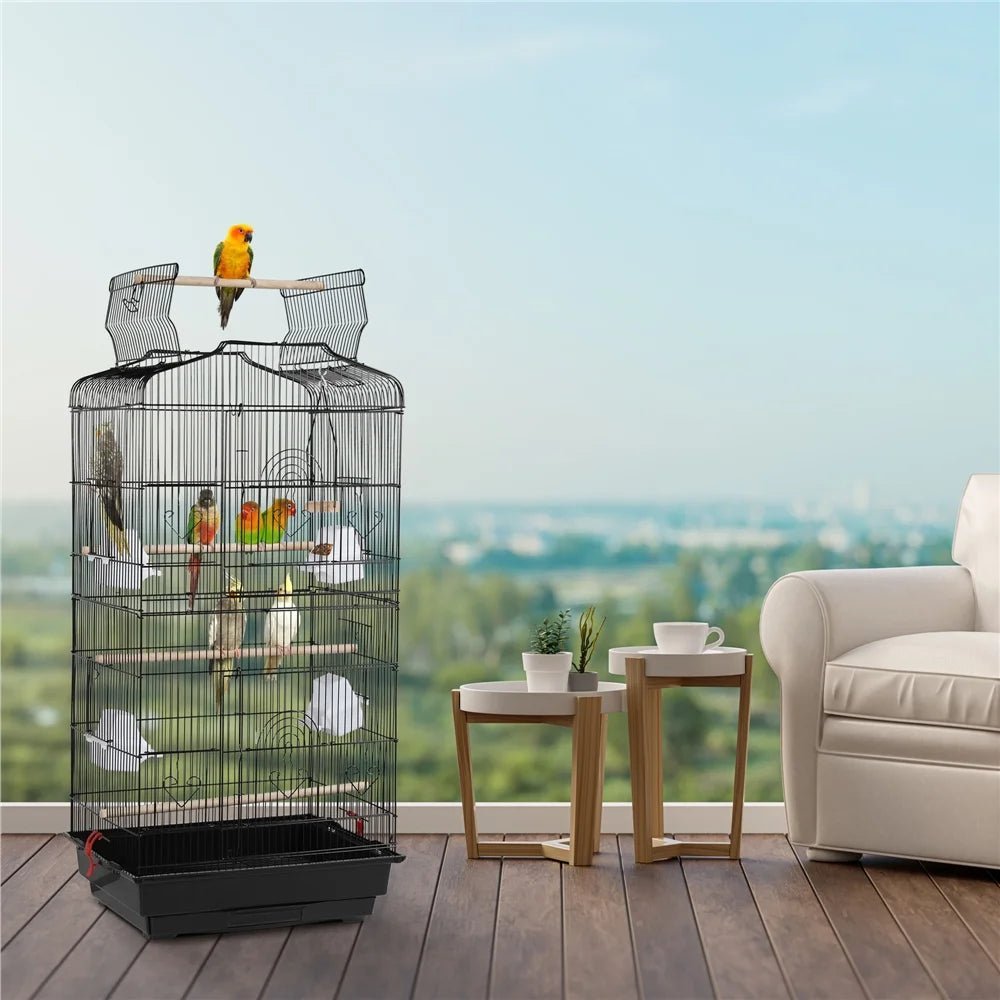 Bird cage with parrots in a room with a couch and tables