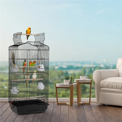 Bird cage with parrots in a room with a couch and tables