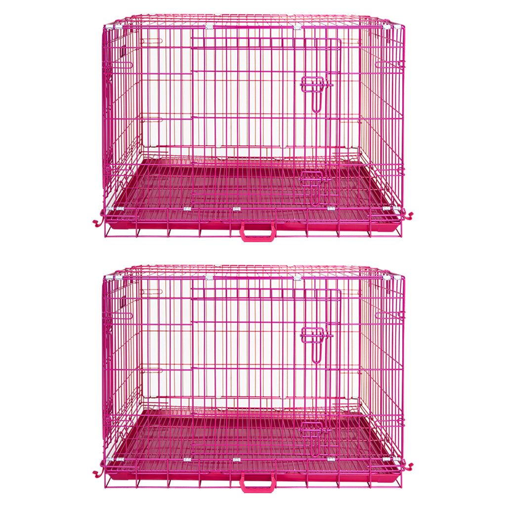 Two pink metal dog crates on a white background