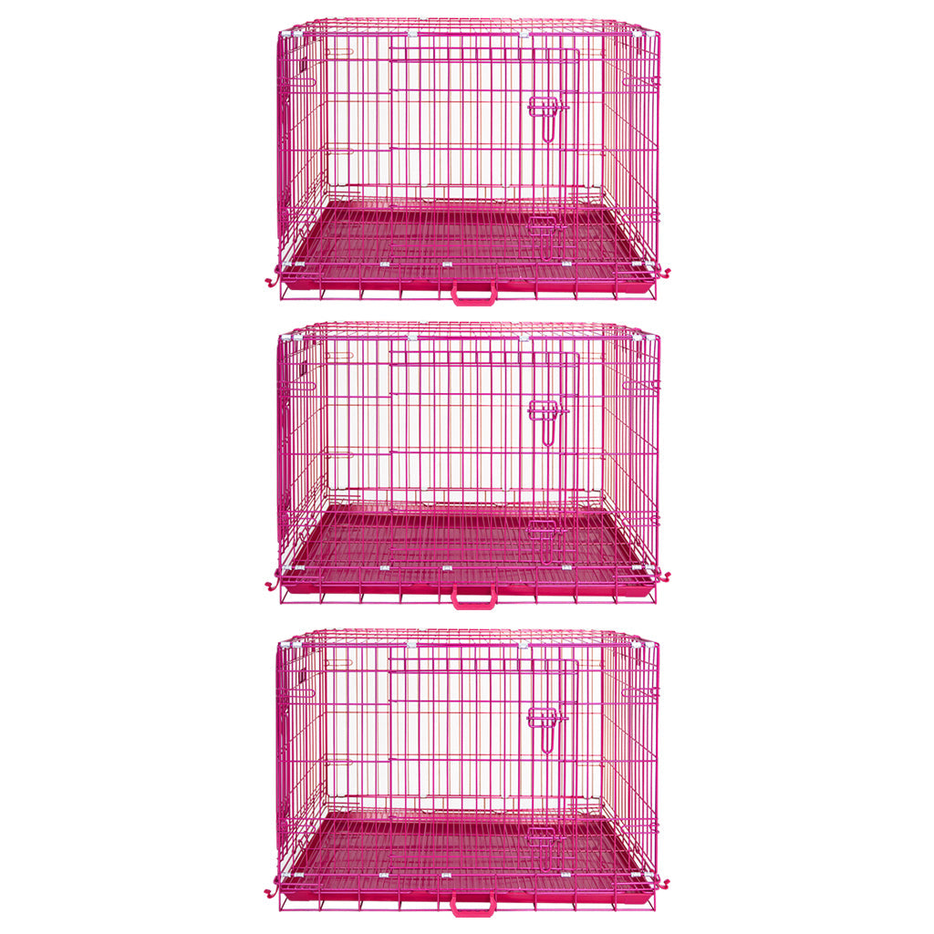 Set of three pink metal pet crates on a white background