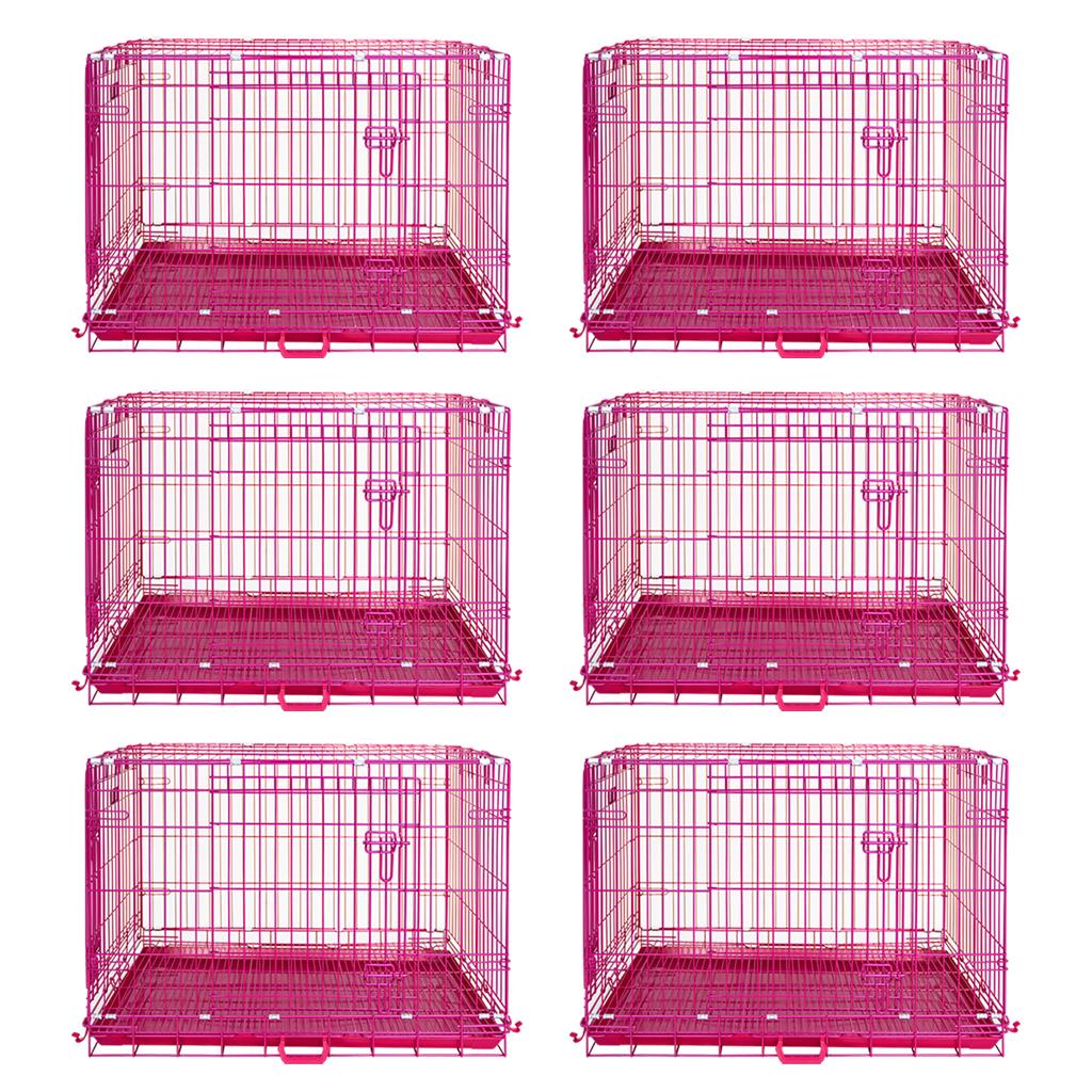 Six pink metal dog crates on a white background