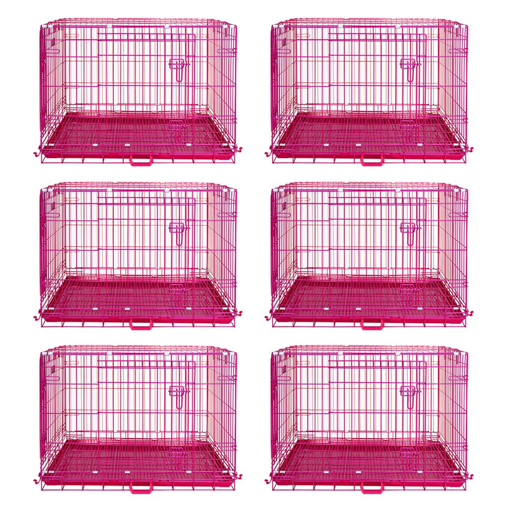 Six pink metal dog crates on a white background