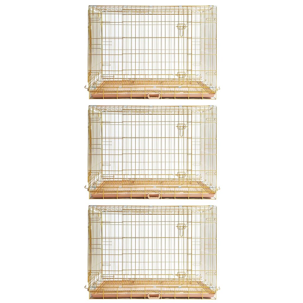 Set of three gold wire bird cages on a white background