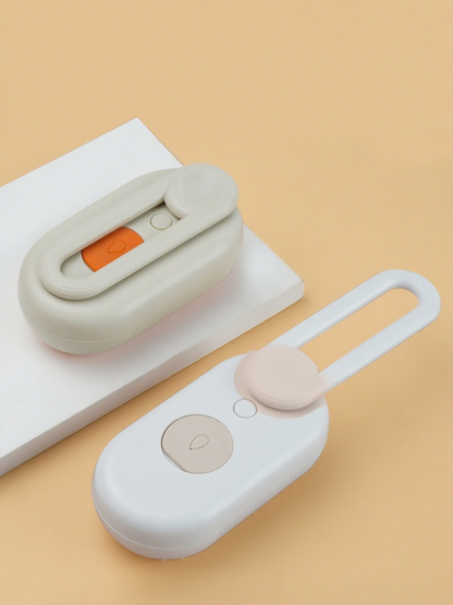 Two small electronic devices on a beige background