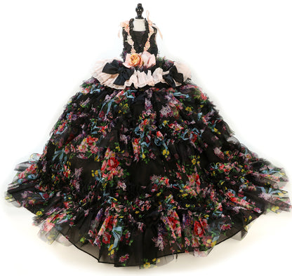 Black floral gown on a mannequin against a white background