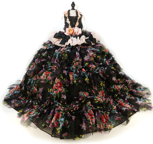 Black floral gown on a mannequin against a white background