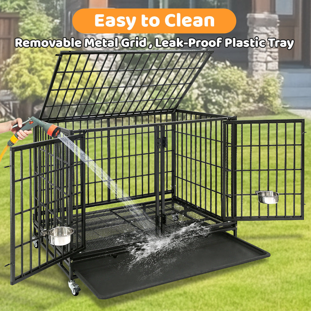 Dog crate with removable metal grid and leak-proof plastic tray being cleaned with a hose.