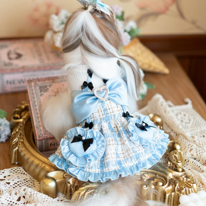 Decorative doll with a blue dress on a lace surface