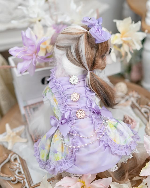 Doll in a decorative setting with flowers and decorative elements