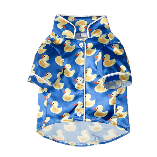 Children's swim shirt with rubber duck pattern on a blue background