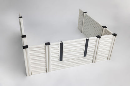 White pet playpen with black straps on a light gray background