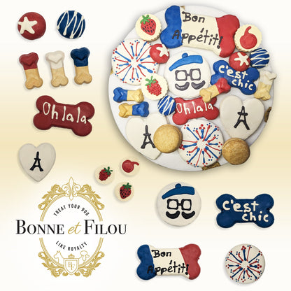 Assorted dog treats with decorative designs and text on a white background, featuring the brand 'Bonne et Filou'.