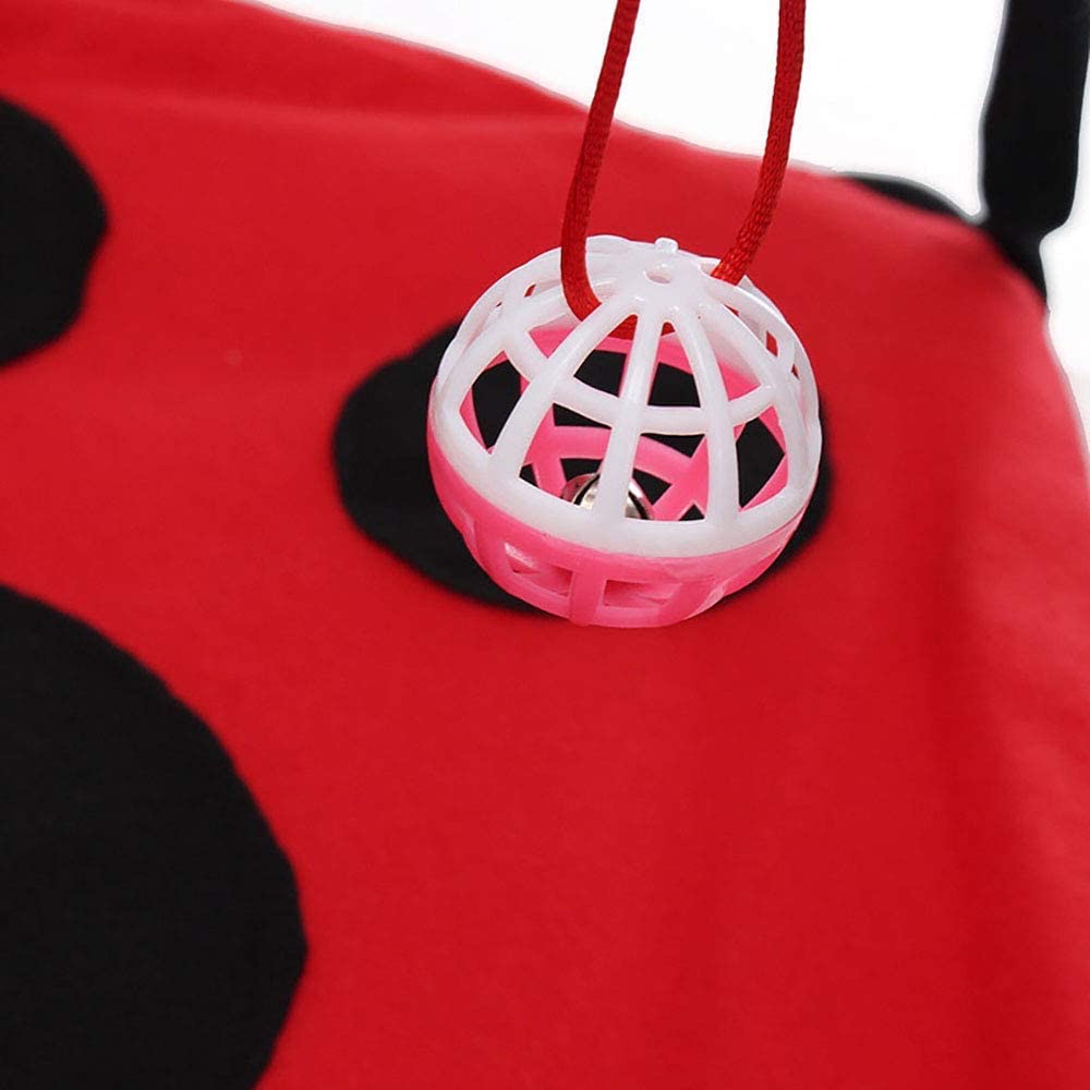 Pink and white ball on a red and black plush toy