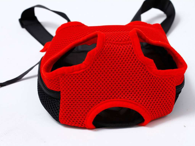 Red and black pet harness on a white background