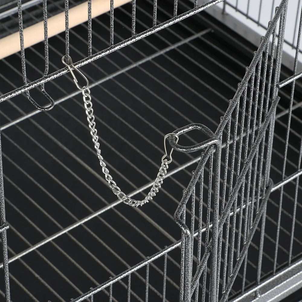 Close-up of a metal bird cage with a chain