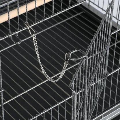 Close-up of a metal bird cage with a chain