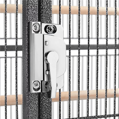 Metal gate latch mechanism on a metal fence with wooden handles