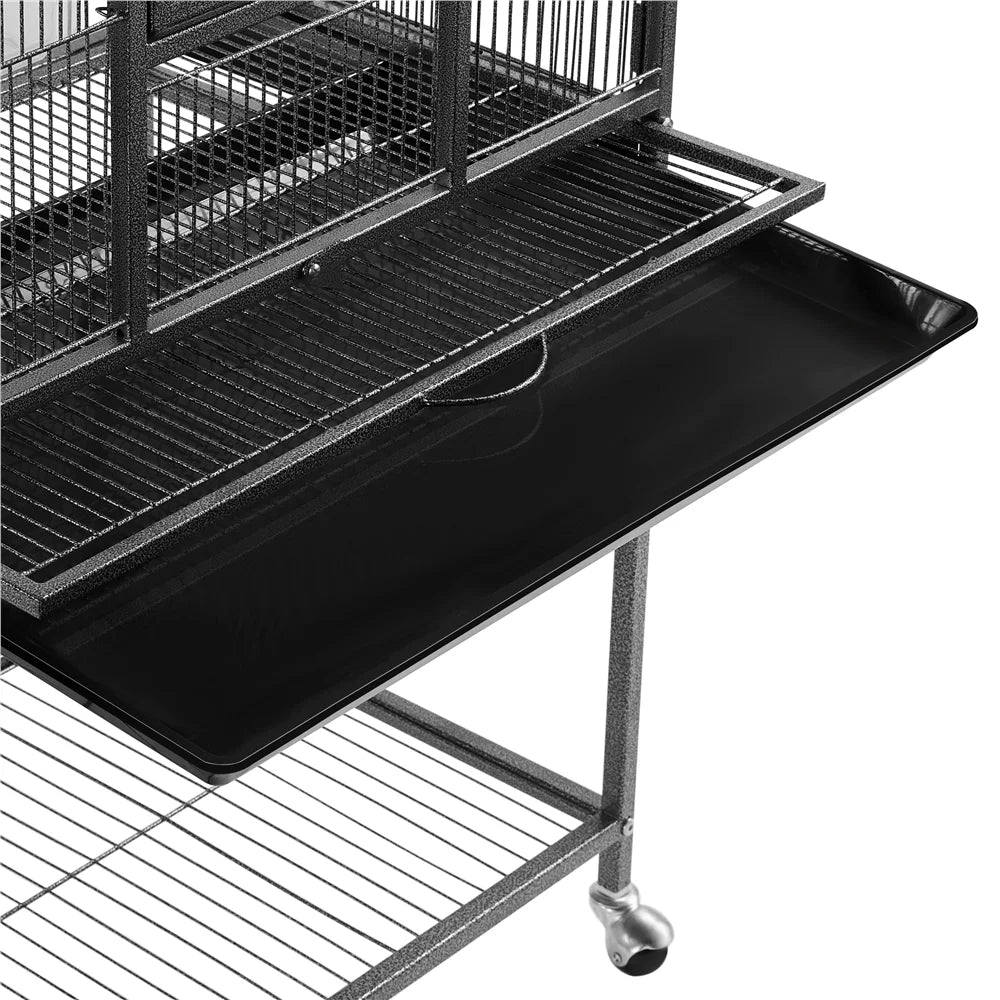 Black bird cage with a flat tray on a white background