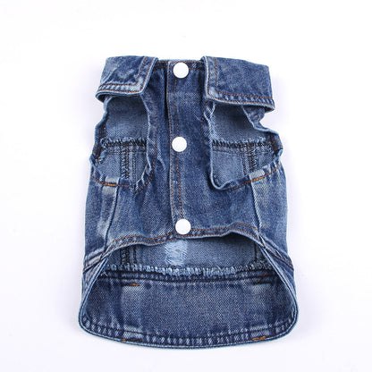 Blue denim dog vest with button details on a white background