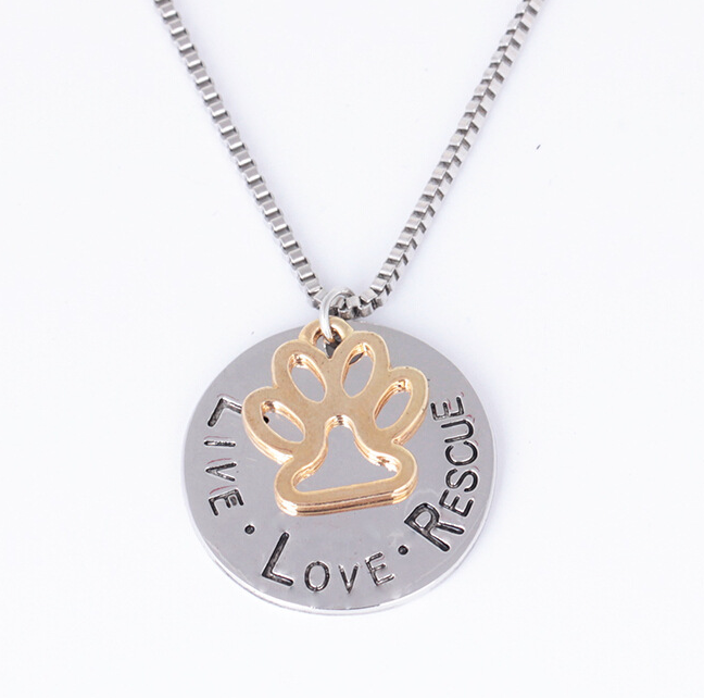 Necklace with a paw print pendant and 'Live Love Rescue' text on a white background
