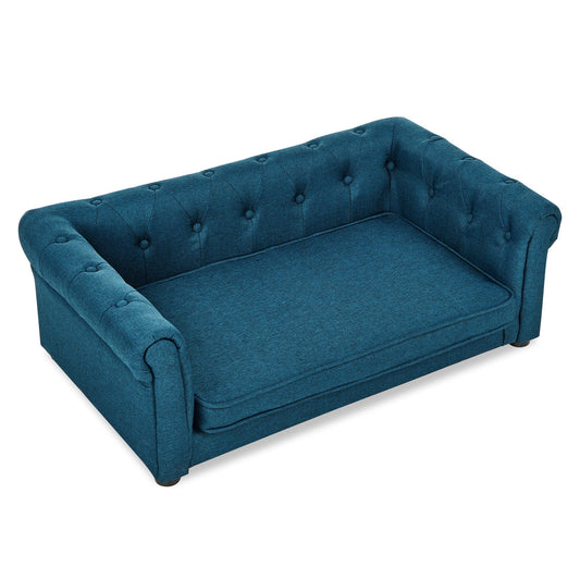 Blue tufted sofa on a white background