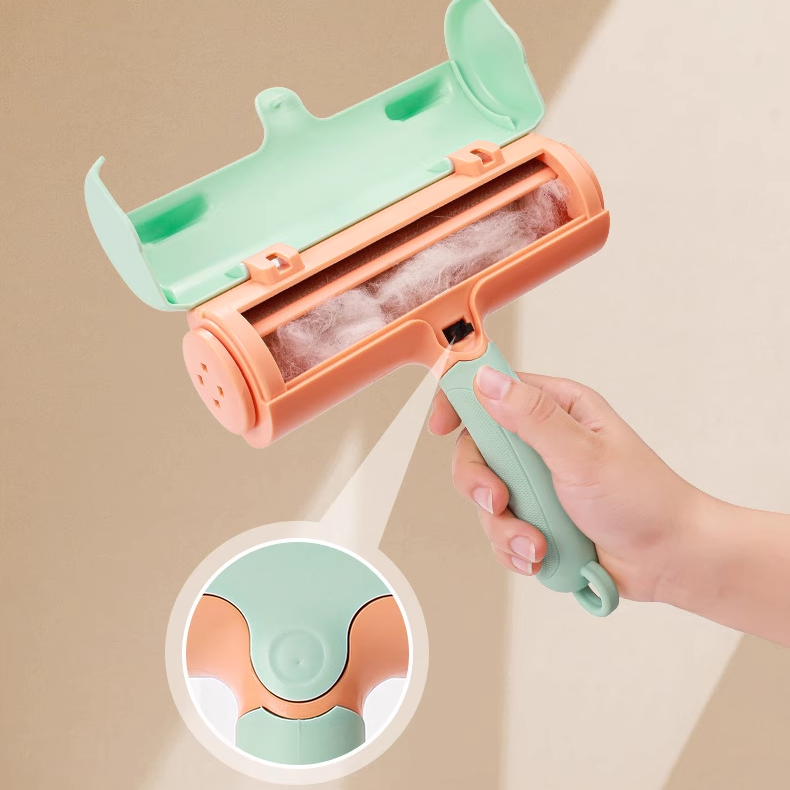 Hand holding a green and pink pet hair removal roller with a close-up inset on a beige background.
