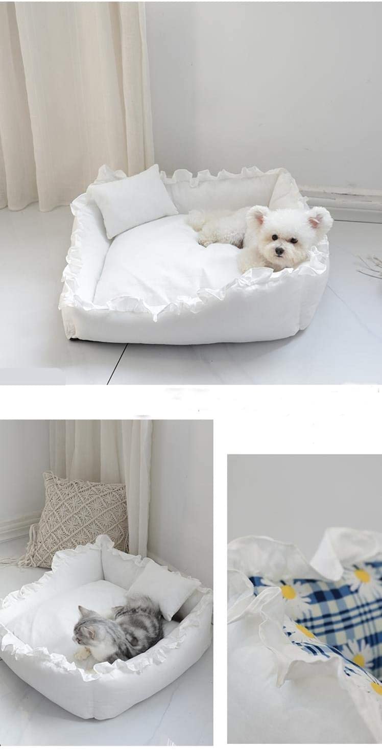 White pet bed with fluffy white pillow and blanket, featuring a small dog and cat inside.