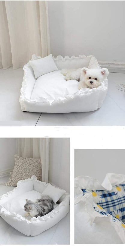 White pet bed with fluffy white pillow and blanket, featuring a small dog and cat inside.