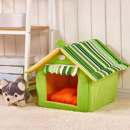Green pet house with striped roof in a room setting